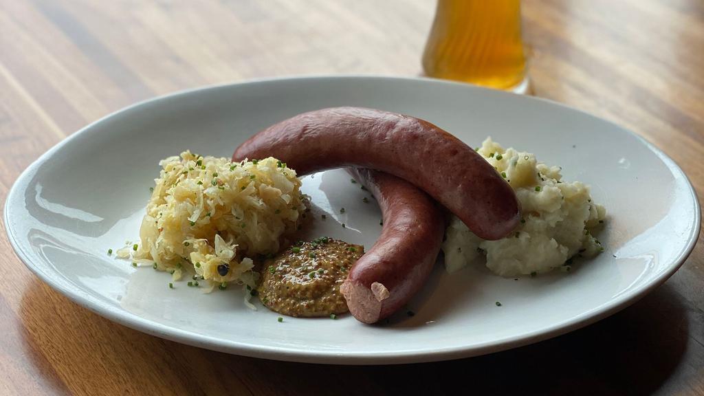Bier Sausage Dinner · A smoked beef and pork Bavarian bier sausage served with stoneground mustard served with mashed potatoes and pineapple sauerkraut.