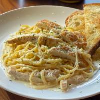 Chicken Alfredo Linguini · Fresh linguini pasta tossed in our house
made alfredo sauce, topped with grilled chicken
bre...