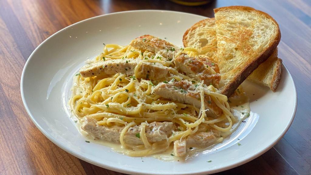 Chicken Alfredo Linguini · Fresh linguini pasta tossed in our house
made alfredo sauce, topped with grilled chicken
breast and fresh grated parmesan cheese
served with garlic toast.