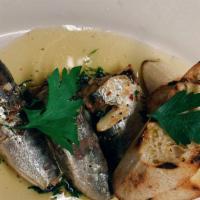 Sardine · Spanish sardines in oil served with salsa verde and toasted bread.