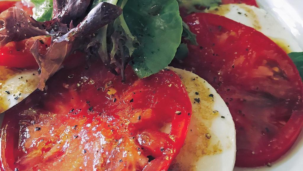 Caprese · Sliced tomato, fresh mozzarella and basil with side of balsamic vinaigrette
