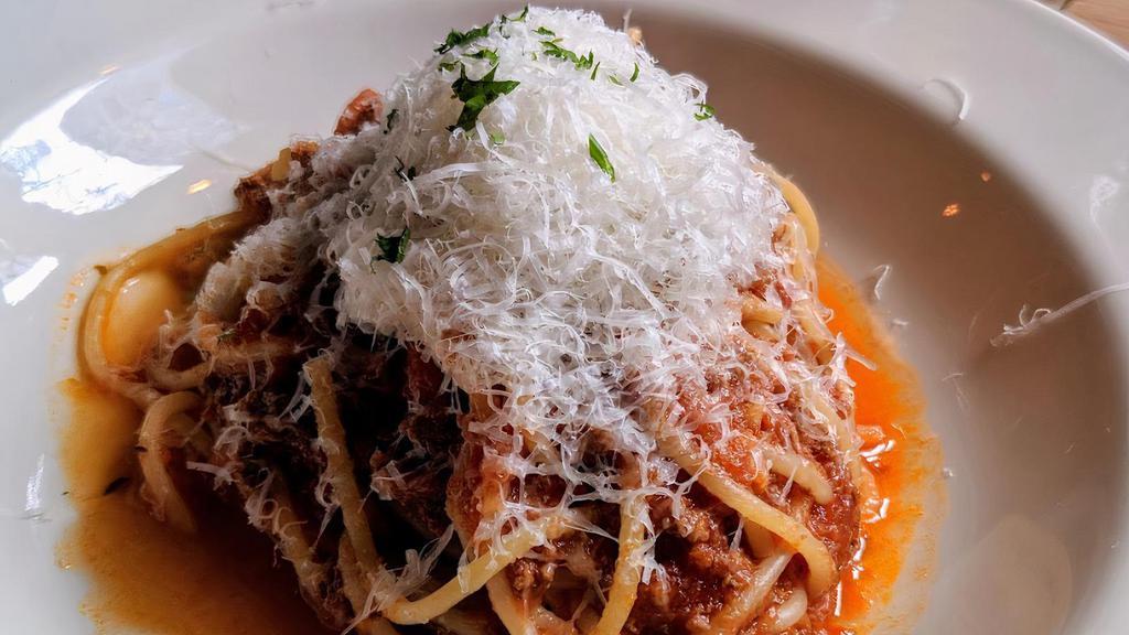 Spaghetti Al Sugo Di Carne · Slow simmered beef and tomato Bolognese with parmigiano.