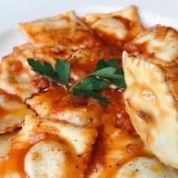 Ravioli · Handmade stuffed pasta in a fresh tomato sauce with parmigiano (choice of fillings).
