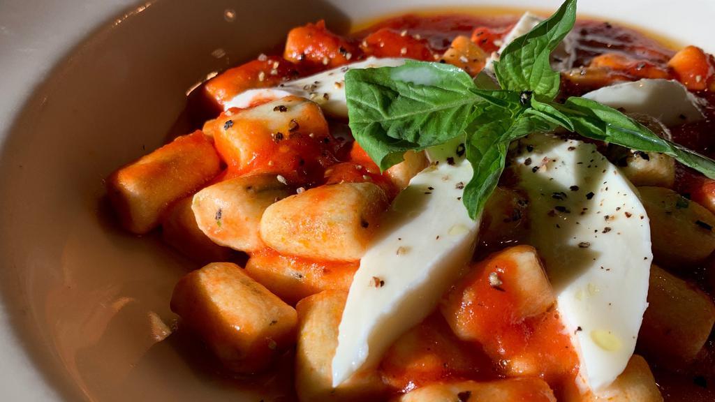 Gnocchi Sorrentina · Handmade ricotta gnocchi in fresh tomato sauce with mozzarella and basil.
