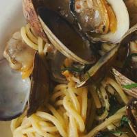 Spaghetti Alle Vongole · Fresh clams in a white wine sauce with garlic and red chili flake.