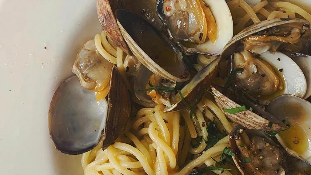 Spaghetti Alle Vongole · Fresh clams in a white wine sauce with garlic and red chili flake.