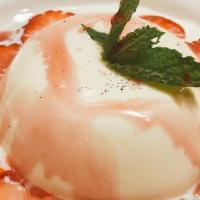 Panna Cotta · Sweet vanilla cream custard topped with fresh berries.