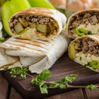Steak And Eggs Breakfast Burrito · Juicy steak, fresh eggs, and cheese wrapped in a large warm flour tortilla.