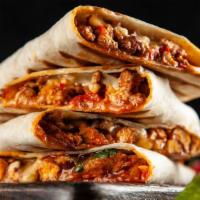 Pollo Asado Quesadilla · Seasoned grilled chicken and melted cheese folded into a warm flour tortilla, served with a ...