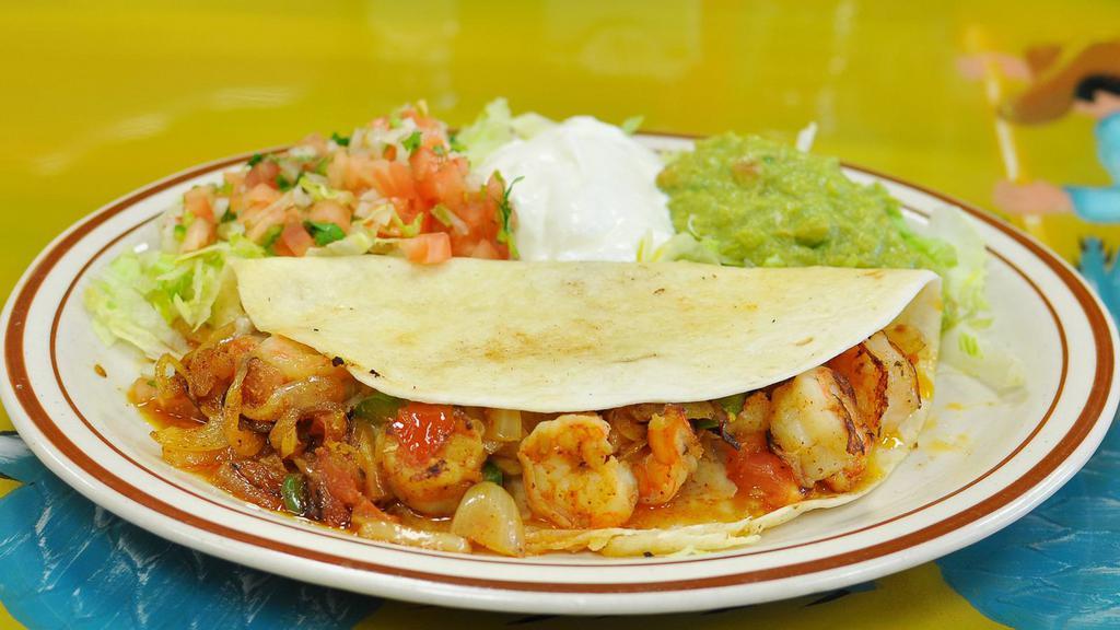 Shrimp Quesadilla · Fresh caught shrimp, red sauce, and melted cheese folded into a warm flour tortilla, served with a side of guacamole and sour cream.