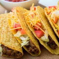 Beef Tacos Combo Platter (#3) · Two shredded beef tacos, served with fresh made Spanish rice and hearty beans.