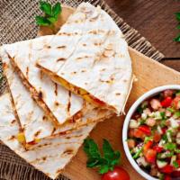 Junior Quesadilla · Melted cheese folded into a warm flour tortilla, served with a side dish.