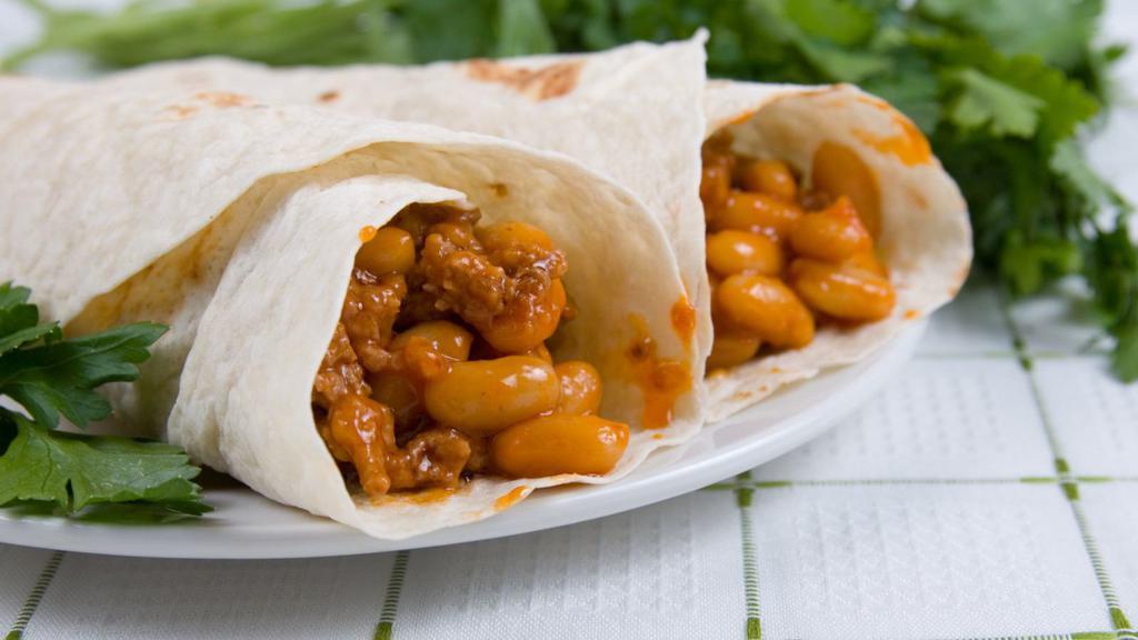 Junior Bean And Cheese Burrito · Warm cheese and hearty beans wrapped into a warm flour tortilla, served with a side dish.