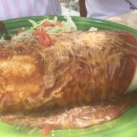 Carne Adovada Burrito · A flour tortilla stuffed with scrambled eggs, hash browns, smothered with a choice of red or...