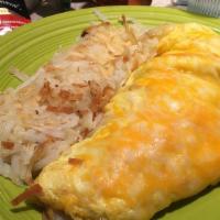 Small Denver Omelet · Diced ham, onions, bell peppers, cheddar and Jack cheese. Served with a lighter portion of i...