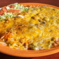 Huevos Rancheros · Corn or flour tortillas, 2 eggs any style, hash browns and beans smothered in red or green c...