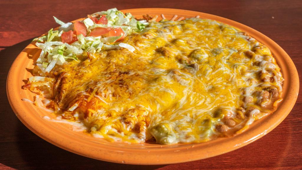 Huevos Rancheros · Corn or flour tortillas, 2 eggs any style, hash browns and beans smothered in red or green chile with cheddar and Jack cheese.