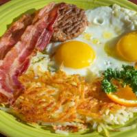 3 Breakfast Enchiladas · Enchiladas, hash browns, beans, with red or green chile, topped with 2 eggs any style, chedd...