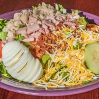 Chef Salad · Fresh mixed greens topped with ham, turkey, chopped bacon, cheddar cheese, hard boiled egg a...