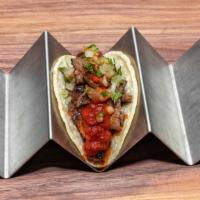 Carne Asada Taco · Corn tortilla, seasoned steak, onion, cilantro, choice of salsa
verde or salsa rojo.