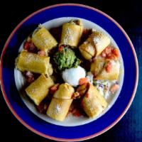 Chicken Taquitos · Two rolled flour tortillas stuffed with chicken and Jack cheese.served crispy. Garnished wit...