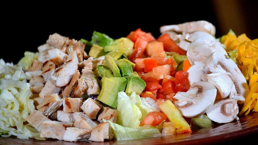 La Bandera Ensalada · Garden salad generously topped with choice of fajitas. Finished with mushrooms, tomatoes, avocados and cheese