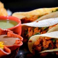 Tacos Al Pastor · Diced pork marinated in our special spice blend including Chile California, pineapple, lemon...
