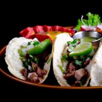 Carnitas Tacos · Slow cooked, simmered, roasted pork, creating a beautiful alternating texture of softness wi...