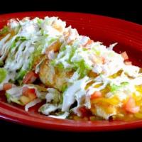 Macho Burrito · A super flour tortilla filled with rice, beans and choice of ground beef, chicken or picadil...