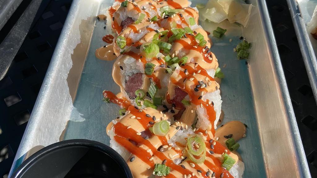 Spicy Tuna Roll · Gluten-free. Ahi tuna, green onion, cucumber, spicy aioli, sriracha, sesame seeds.

These items are served raw or lightly cooked. Consuming raw or undercooked meats, poultry, seafood, shellfish, or eggs may increase your risk of foodborne illness.
