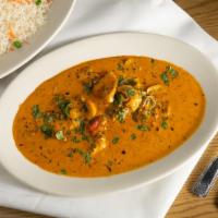 Bombay Seafood Curry · This is one of our most popular specialties.  Codfish, prawns, scallops, and mushrooms all s...
