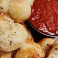 Garlic Knots · tossed in butter, fresh garlic, and Parmesan