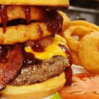 Bbq Burger · BBQ sauce, cheddar cheese, onion ring, with choice of fries, tater tots, or onion rings (+1)