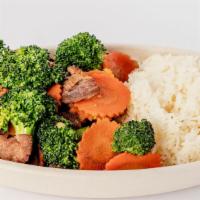 Broccoli Stir Fry · Tender slices of beef sauteed in sweet rice's sauce with carrots and broccoli. Served with a...