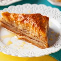 Baklava · Sweet flaky pastry made of layers of filo filled with walnuts and soaked in a honey syrup.