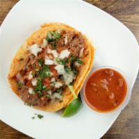 Birria Taco · Daily made corn tortillas (soft or fry), fresh cilantro, onion with a side of our famous sal...