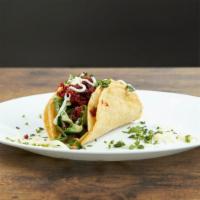 Chorizo Taco · Daily made corn tortillas (soft or fry), fresh cilantro, onion with a side of our famous sal...