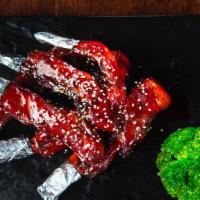 蜜汁排骨/Honey Spare Ribs(5 Pieces) · Slow-braised pork ribs wok-seared with a tangy Asian barbecue sauce.