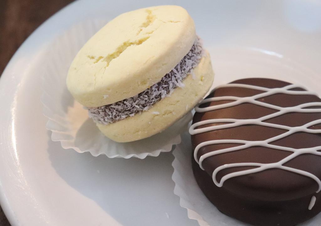Alfajor · -Chocolate Alfajor: Sandwich of dulce de leche(caramel) with two delicious hand made cookies covered in dark chocolate
-Maicena Alfajor: sandwich of dulce de leche with two corn starch cookies with coconut flakes on the side.
each $4.25