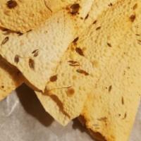 Papadam · Crispy crackers made from lentil flour.