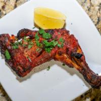 Chicken Leg Quarter · Marinated with yogurt, herbs and spices finished in a clay oven served with mint and tamarin...