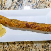 Chicken Seikh Kebab - Single · Prepared with ground chicken meat with herbs and Indian spices rolled on skewers and finishe...