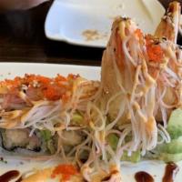Crazy Dragon Roll · Inside shrimp tempura and yellowtail. Outside avocado, spicy kani, and masago special sauce.