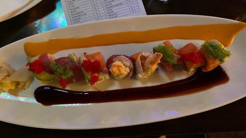 Kurosawa Roll · Inside spicy tuna, shrimp tempura and outside tuna, salmon, avocado, tobiko, and soybean wrap special sauce.