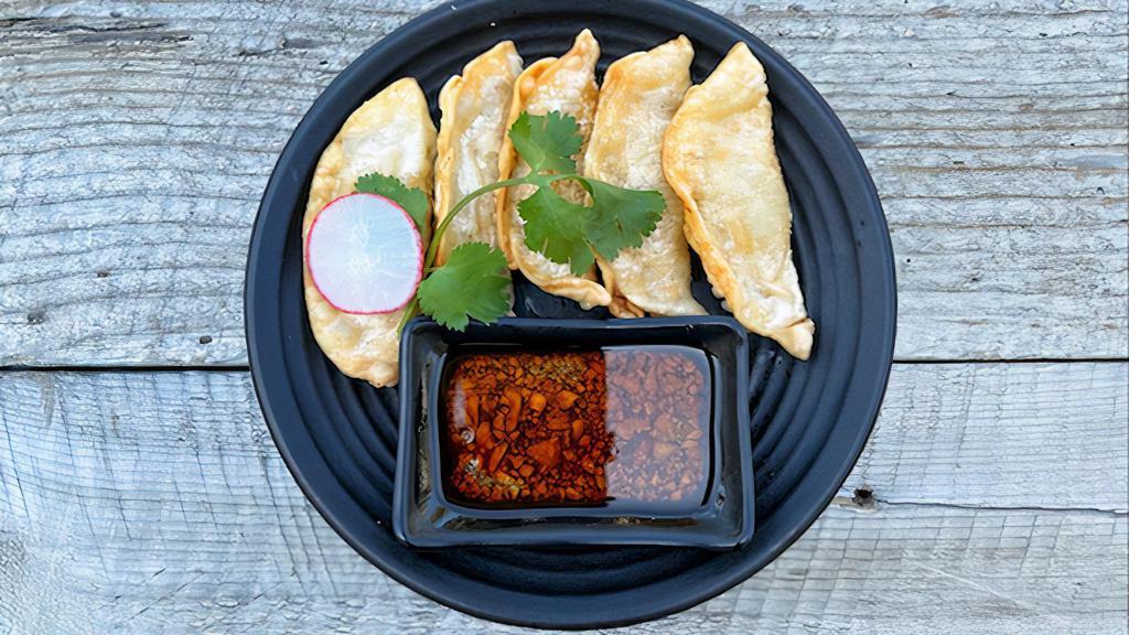 Fried Dumplings  · Fried shrimp and veggie dumplings (5) served with our house spicy sauce.