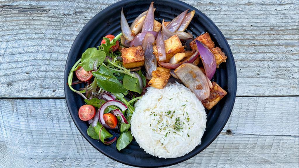 Stir-Fried Tofu Platter · Tofu stir-fried with secret sauce, red onions, served with side of salad and white rice.