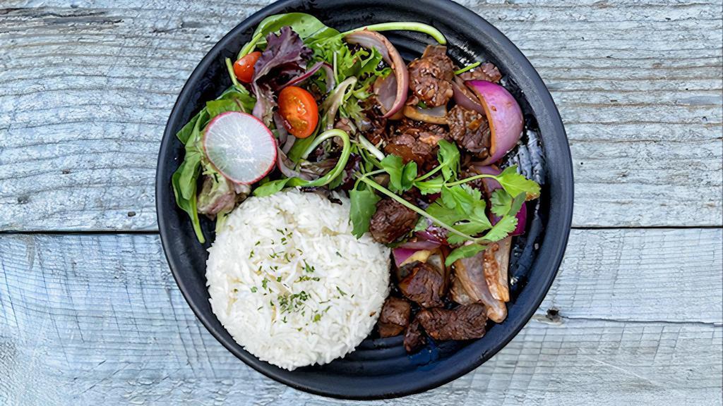 Shaken Beef Platter · Filet Mignon stir-fried with secret sauce, red onions served with side of salad and white rice.