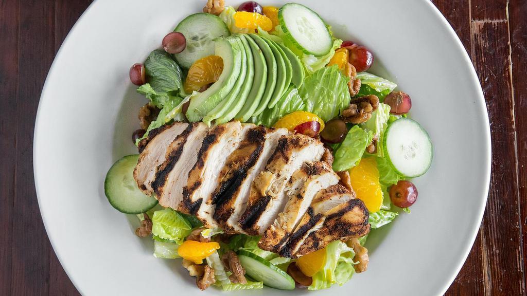 Sweet And Spicy Chicken Salad · Grilled chicken, candied walnuts, mango passion fruit ginger dressing, apples, avocado, pickled cucumber, mandarin oranges, grapes and romaine hearts.