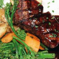 Filet Mignon · 7oz Filet grilled to order, Cabernet demi-glace and seasonal vegetables. Choice of garlic ma...