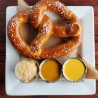 House Baked Pretzel · Freshly baked pretzel with Redmond's cheese sauce, honey mustard, and chipotle aioli.